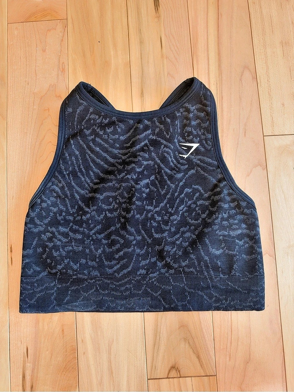 Gymshark seamless crop top in black with a subtle animal print.